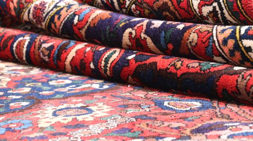 Full view of 1940s Bakhtiar rug from Iran / Persia, 327 × 209 cm in Red tones