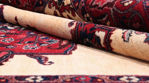 Corner detail of 1960s Bakhtiar rug showing border pattern and Wool pile