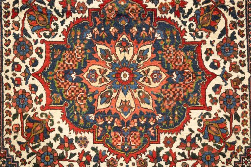 Backside of handmade 1940s Bakhtiar rug showing knot structure and weave density