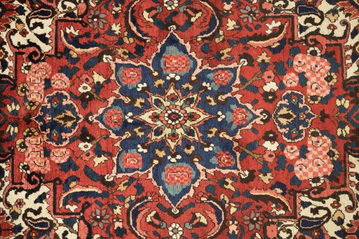 Full view of 1930s Bakhtiar rug from Iran / Persia, 381 × 272 cm in Cream tones