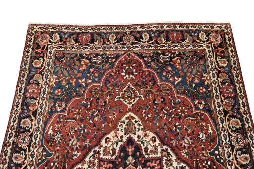 Surface texture of 1930s Bakhtiar rug with natural Wool and intricate pattern