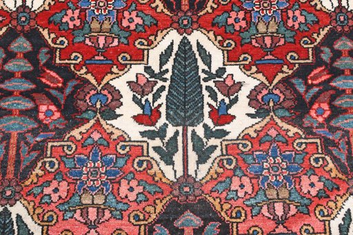 Surface texture of 1950s Bakhtiar rug with natural Wool and intricate pattern