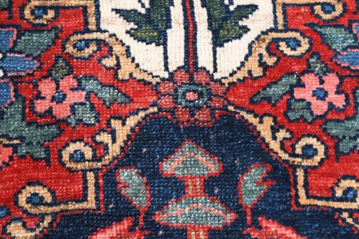 Backside of handmade 1950s Bakhtiar rug showing knot structure and weave density