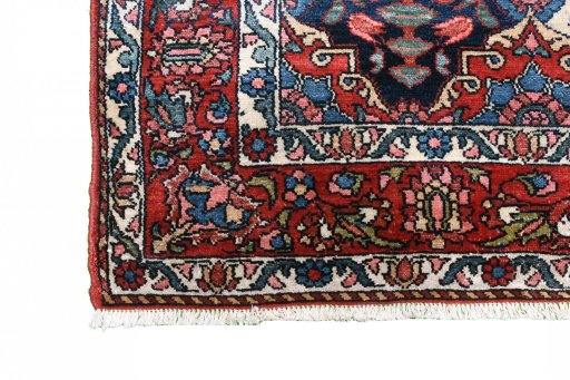 Full view of 1950s Bakhtiar rug from Iran / Persia, 208 × 139 cm in Red tones