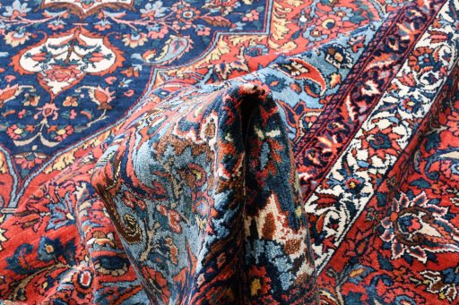 Backside of handmade 1930s Bakhtiar rug showing knot structure and weave density