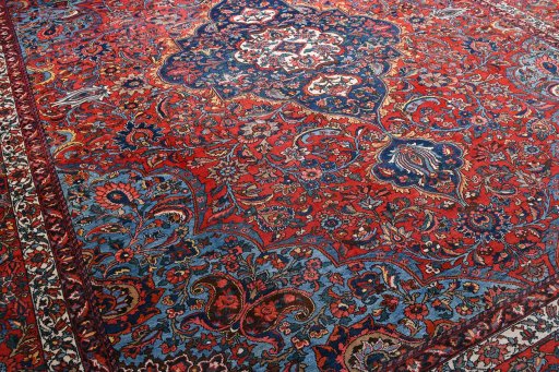 Full view of 1930s Bakhtiar rug from Iran / Persia, 437 × 379 cm in Red tones