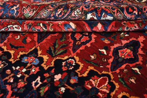 Backside of handmade 1930s Bakhtiar rug showing knot structure and weave density