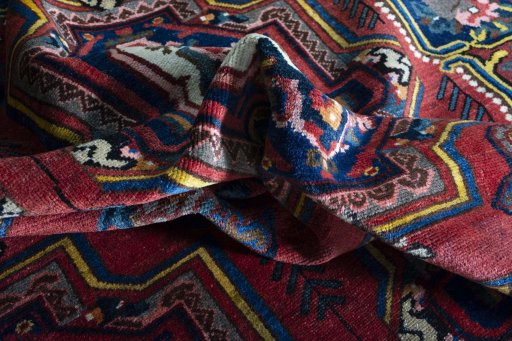 Surface texture of 1930s Bakhtiar rug with natural Wool and intricate pattern
