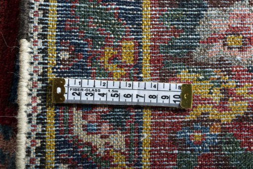 Backside of handmade 1930s Bakhtiar rug showing knot structure and weave density