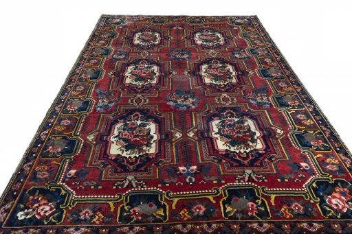 Surface texture of 1930s Bakhtiar rug with natural Wool and intricate pattern