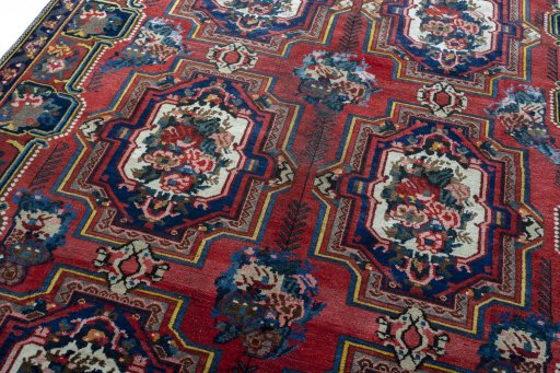 Backside of handmade 1930s Bakhtiar rug showing knot structure and weave density