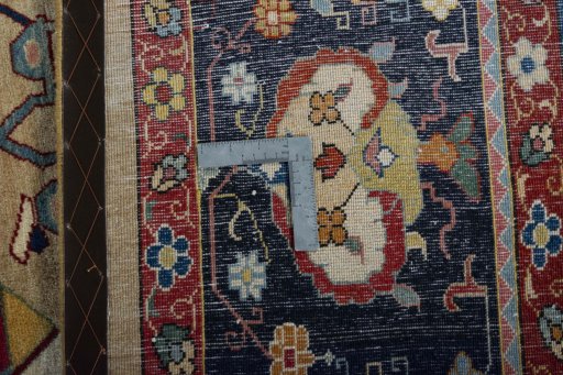 Backside of handmade New Bakhtiar rug showing knot structure and weave density