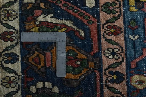 Surface texture of 1930s Bakhtiar rug with natural Wool and intricate pattern