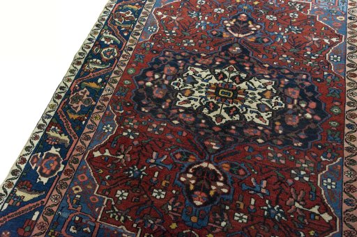 Backside of handmade 1930s Bakhtiar rug showing knot structure and weave density