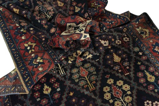 Surface texture of 1930s Bakhtiar rug with natural Wool and intricate pattern