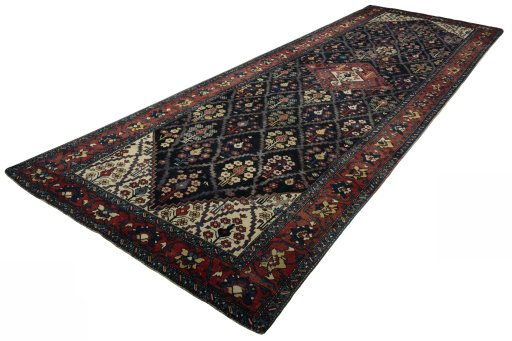 Corner detail of 1930s Bakhtiar rug showing border pattern and Wool pile