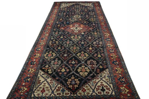 Surface texture of 1930s Bakhtiar rug with natural Wool and intricate pattern