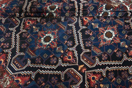 Corner detail of 1930s Bakhtiar rug showing border pattern and Wool pile