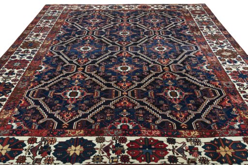 Surface texture of 1930s Bakhtiar rug with natural Wool and intricate pattern