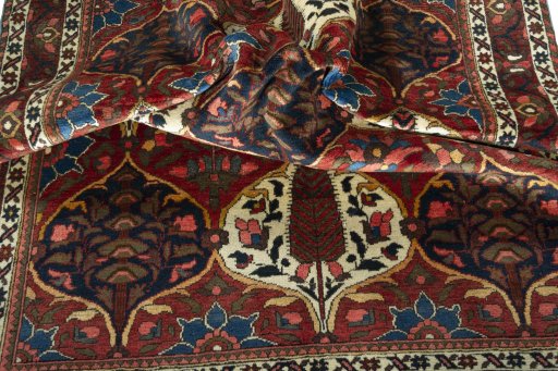 Corner detail of 1950s Bakhtiar rug showing border pattern and Wool pile