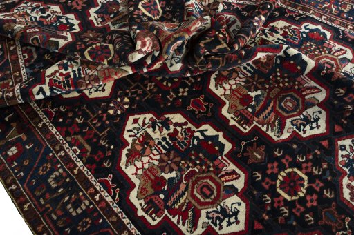 Corner detail of 1950s Bakhtiar rug showing border pattern and Wool pile