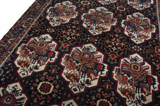Backside of handmade 1950s Bakhtiar rug showing knot structure and weave density