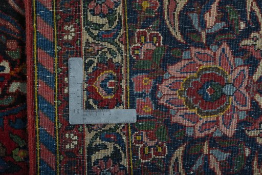 Backside of handmade 1930s Bakhtiar rug showing knot structure and weave density