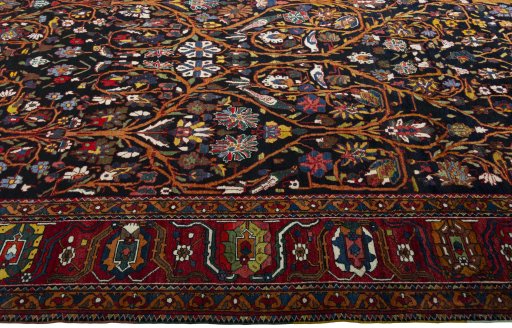 Corner detail of 1930s Bakhtiar rug showing border pattern and Wool pile