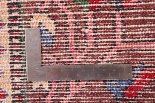 Surface texture of 1985s Bakhtiar rug with natural Wool and intricate pattern