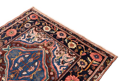 Surface texture of 1974s Bakhtiar rug with natural Wool and intricate pattern