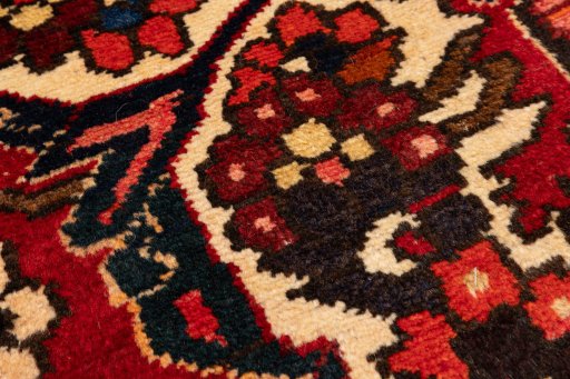 Backside of handmade 1990s Bakhtiar rug showing knot structure and weave density