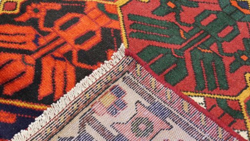 Close-up detail of 1990s Bakhtiar rug from Iran / Persia showing Wool weave