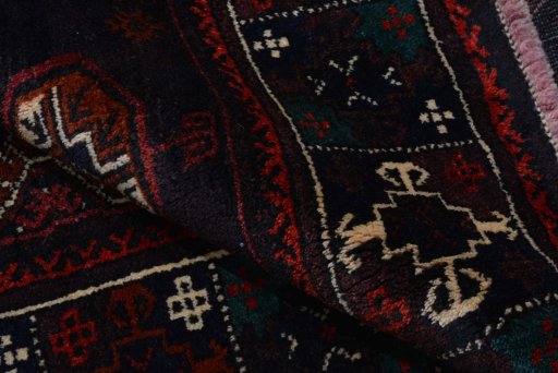 Close-up detail of 2000s Baloch rug from Iran / Persia showing Wool weave