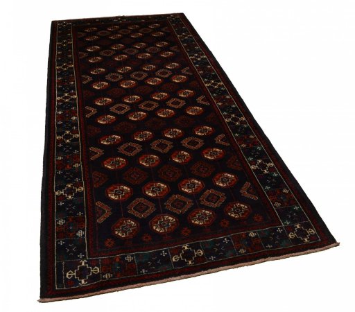 Close-up detail of 2000s Baloch rug from Iran / Persia showing Wool weave