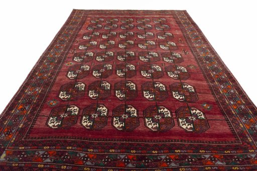 Surface texture of 2000s Baloch rug with natural Wool and intricate pattern