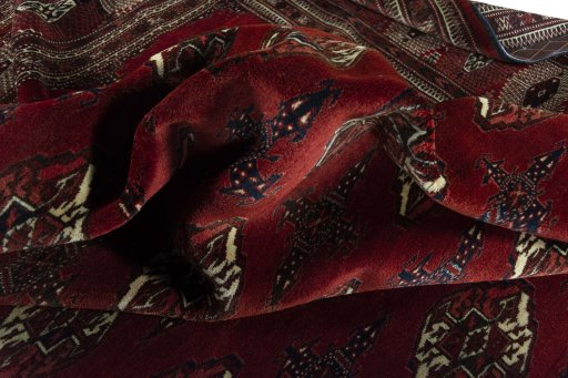 Corner detail of 2000s Baloch rug showing border pattern and Wool pile