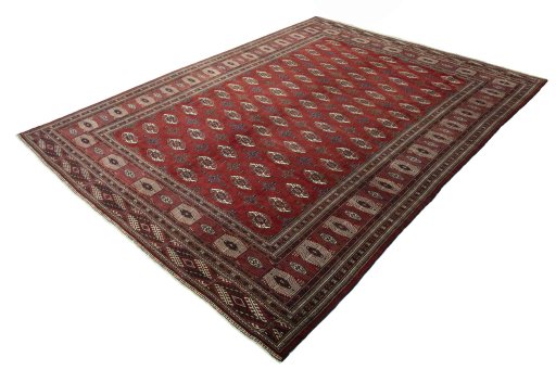 Corner detail of 2000s Baloch rug showing border pattern and Wool pile
