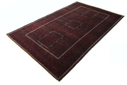 Corner detail of 2000s Baloch rug showing border pattern and Wool pile
