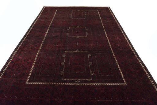 Surface texture of 2000s Baloch rug with natural Wool and intricate pattern