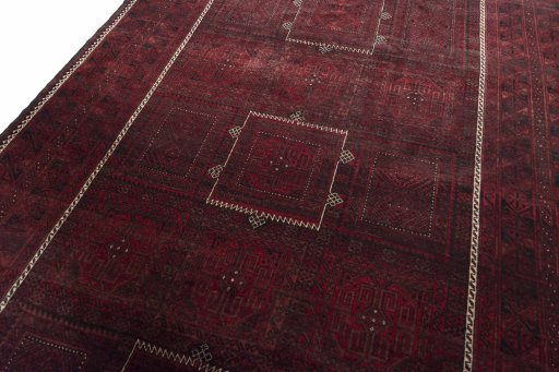 Backside of handmade 2000s Baloch rug showing knot structure and weave density