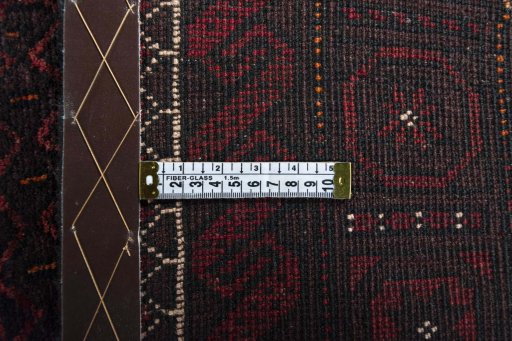 Close-up detail of 2000s Baloch rug from Iran / Persia showing Wool weave