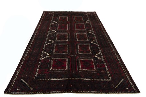 Surface texture of 2000s Baloch rug with natural Wool and intricate pattern