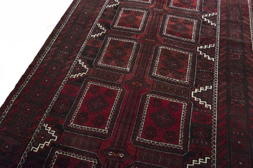 Backside of handmade 2000s Baloch rug showing knot structure and weave density