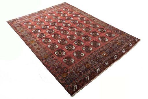 Corner detail of 2000s Baloch rug showing border pattern and Wool pile