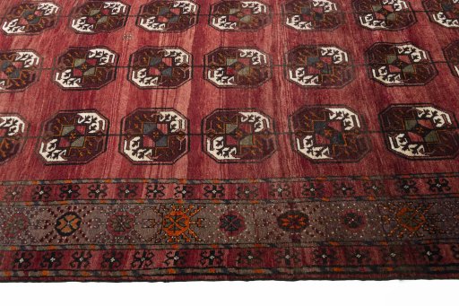 Backside of handmade 2000s Baloch rug showing knot structure and weave density