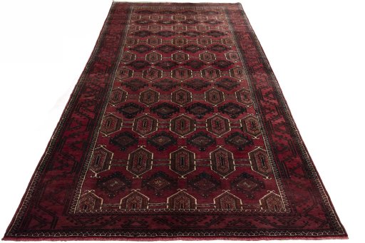 Surface texture of 2000s Baloch rug with natural Wool and intricate pattern