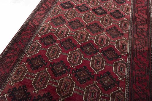 Backside of handmade 2000s Baloch rug showing knot structure and weave density