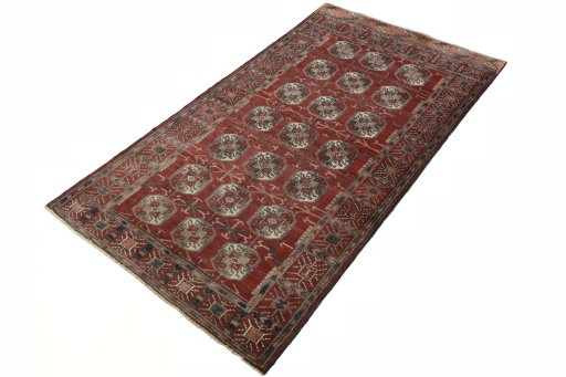 Corner detail of 2000s Baloch rug showing border pattern and Wool pile