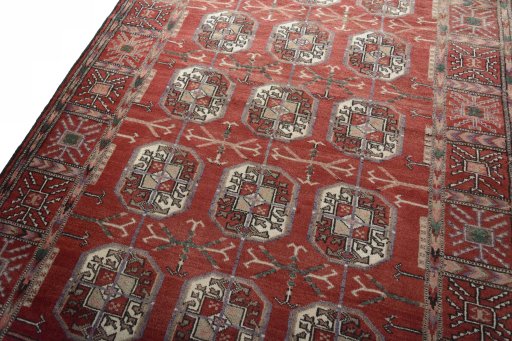 Backside of handmade 2000s Baloch rug showing knot structure and weave density