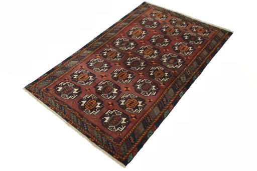 Corner detail of 2000s Baloch rug showing border pattern and Wool pile